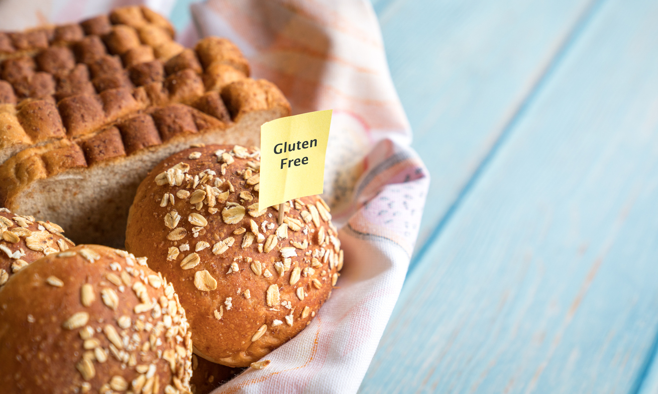 Gluten free label on basket of bread and buns